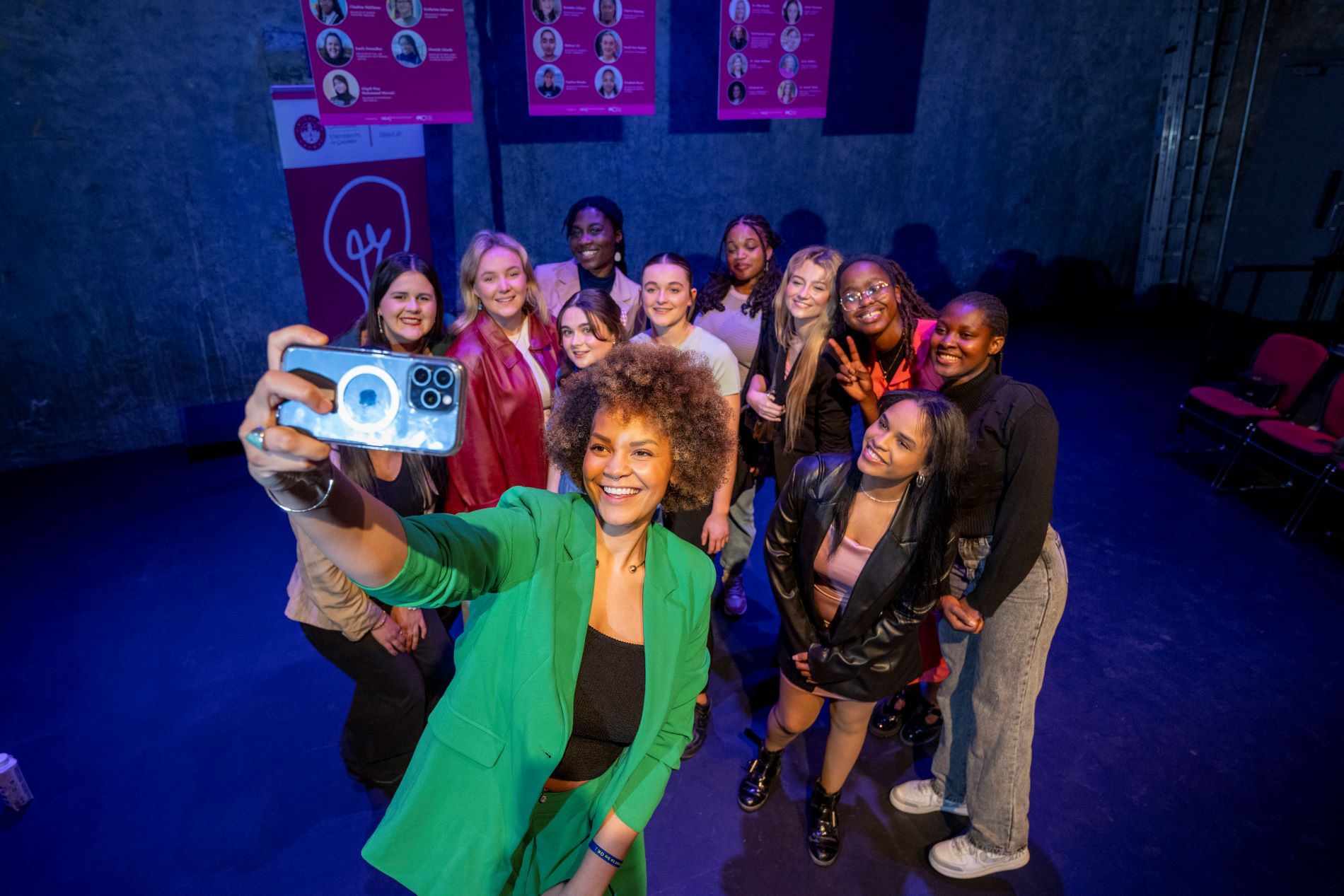 A group shot: photo of Emer O'Neill taking a selfie with a group of female students 